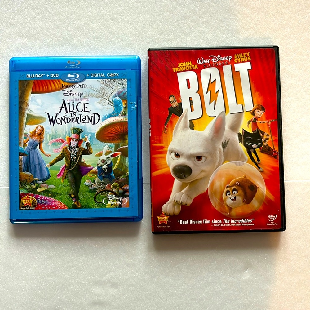 Disney Blue Ray Alice In Wonderland (Johnny Depp) and DVD Bolt ( John Travolta)